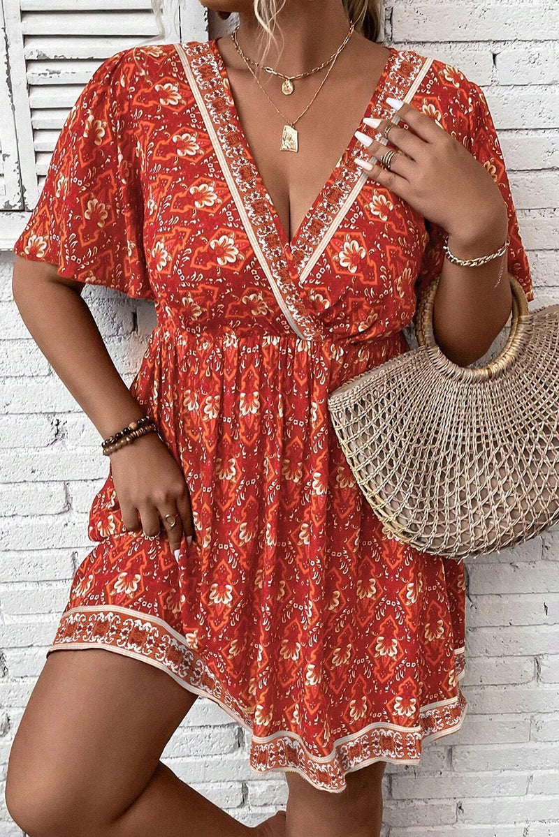 Orange Plus Size Printed Surplice Neck Empire Waist Flowy Mini Dress