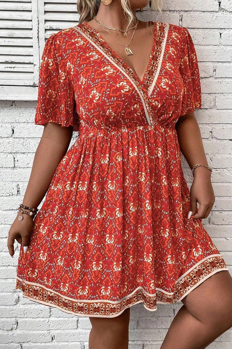 Orange Plus Size Printed Surplice Neck Empire Waist Flowy Mini Dress