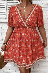 Orange Plus Size Printed Surplice Neck Empire Waist Flowy Mini Dress